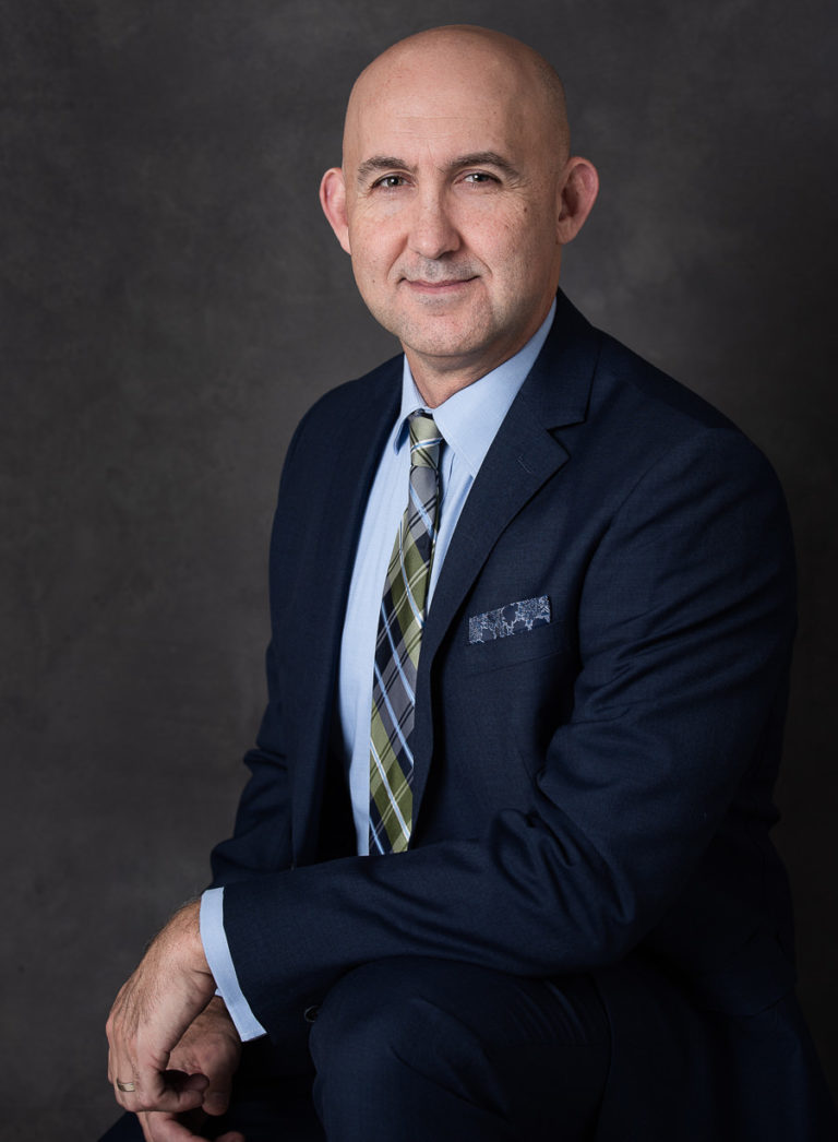 gentleman in suit posing for his headshot